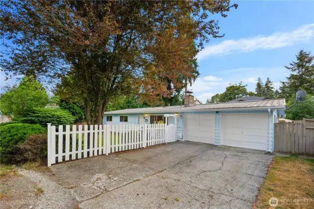 A two car garage plus additional driveway space provide ample parking options