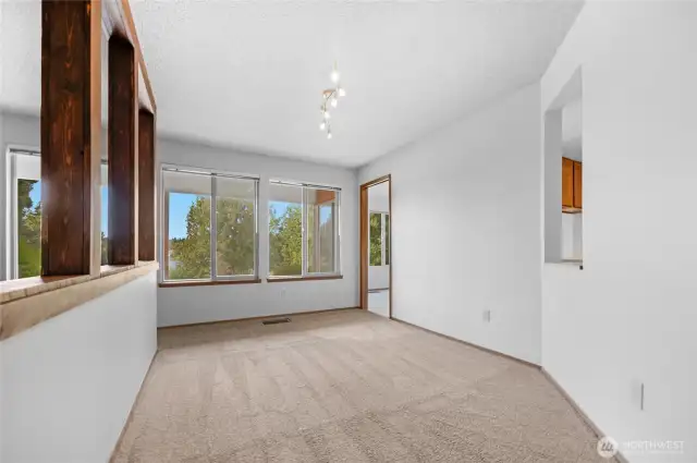 Full sized formal dining room features a serving pass through to the kitchen making entertaining a breeze.