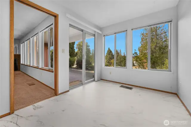 Breakfast nook opens to the patio and features another wall of windows for taking in the view.