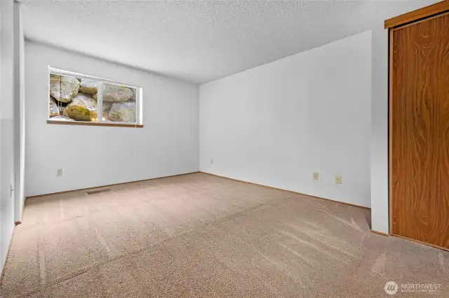 Spacious primary bedroom features 2 separate closets to keep you organized.
