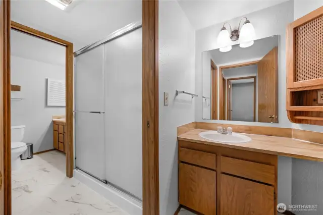 Half bath off the hallway also has access to the shower.