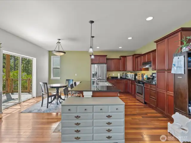 Kitchen with pantry, eat-in island, stainless appliances
