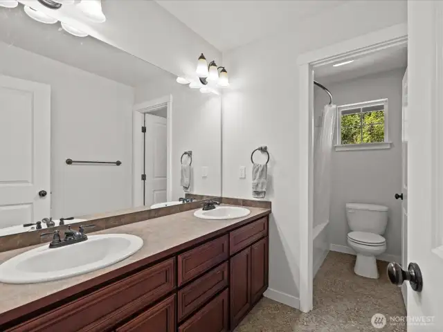 Hallway bathroom with separate area for shower/tub & toilet