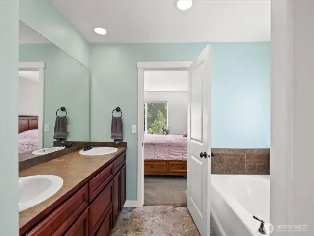 Primary bathroom with deep bathtub & separate shower
