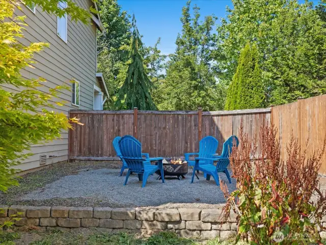 Firepit area in fully fenced backyard