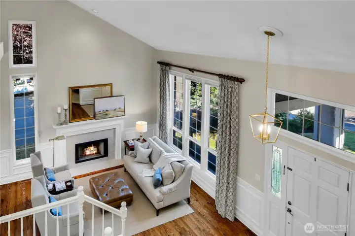 Dramatic & Spacious View of entryway, overlooking formal living room with vaulted ceilings.