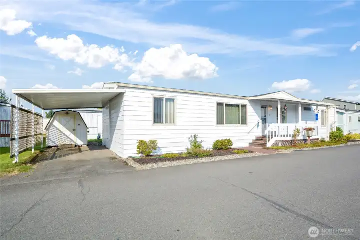 Front of home, showing first parking, and shed