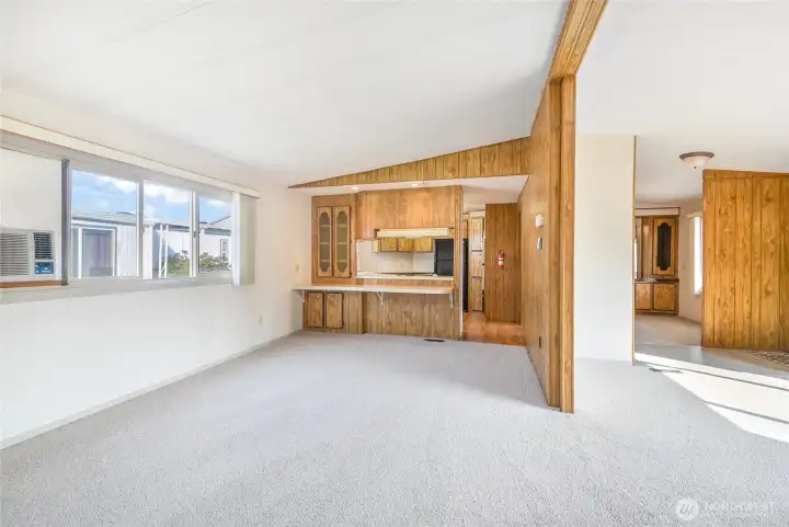 Very nice living area off the kitchen, with brand new carpeting! Do not miss the air conditioner which will stay!