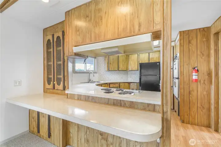 One side of the kitchen with counter space.
