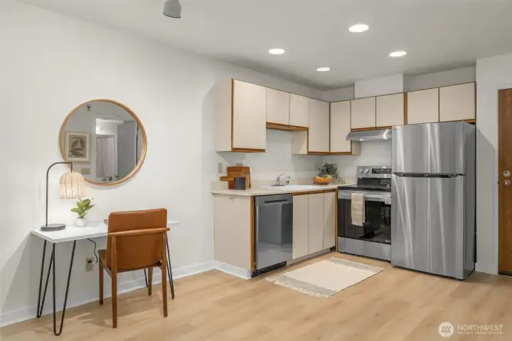 Open studio floor plan with brand new stainless steel LG appliances.