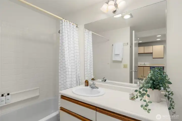 Full bathroom features a built-in closet with ample storage.