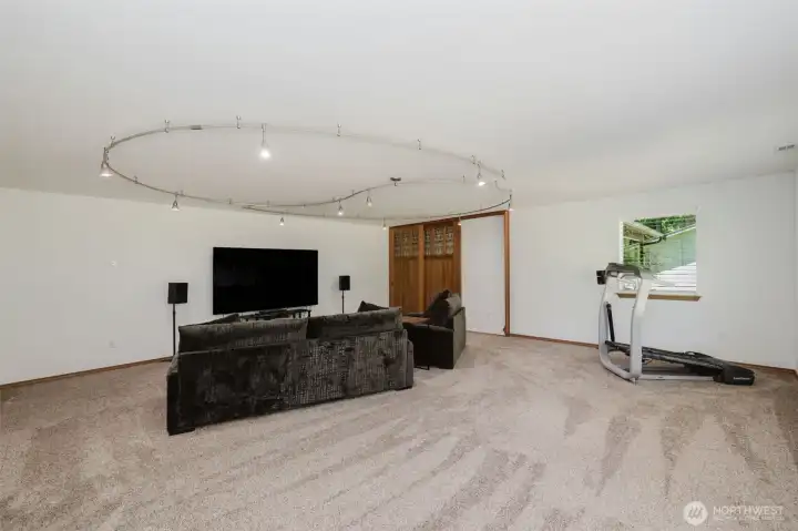 Bonus room with custom lighting and gorgeous cherry Craftsman doors