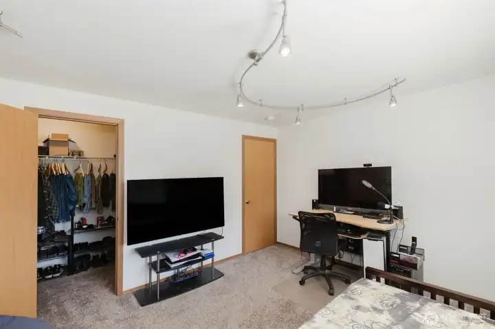 Guest bedroom includes a walk-in closet
