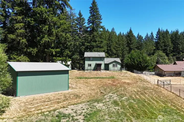 So much space!  So many opportunities to choose from.  Smaller fully fenced portion directly behind the house for a dog run, with so much space for everything else you want to do here.  Shop is perfect for storing big toys and equipment for your homestead!