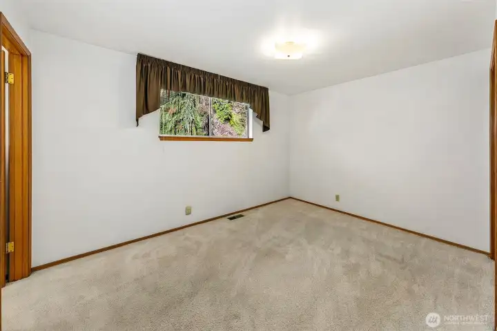 Primary suit off the back of the home has a half bathroom