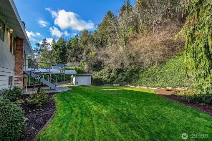 The yard is expansive and 99% level