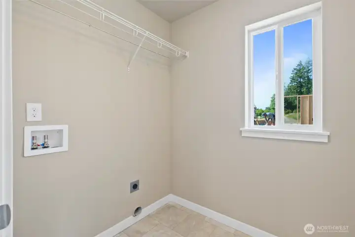 Laundry room located upstairs for convenience.
