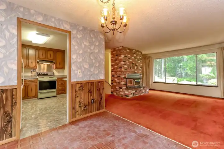 Dining, looking into kitchen and living room