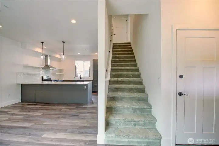 From the front door or garage door entries