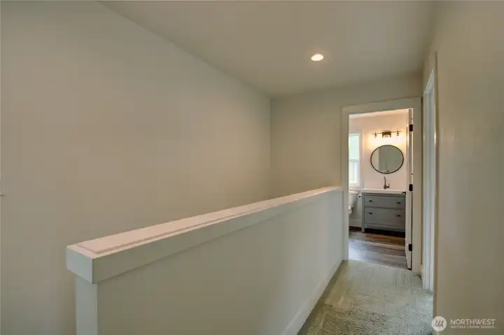 2nd floor hallway leading to full bath