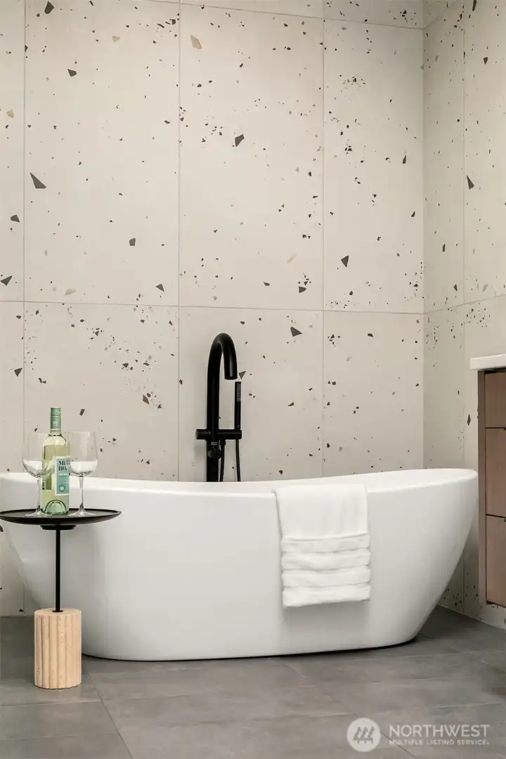 The sculptural bath that serves as a striking centerpiece.