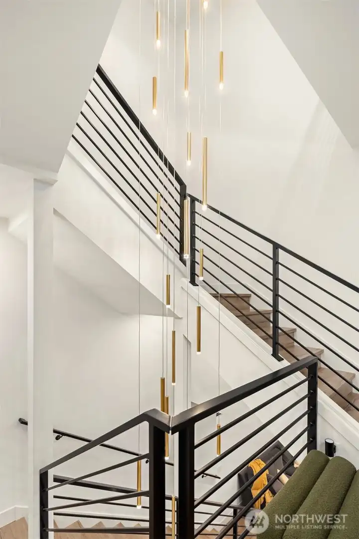 The stunning, tiered brushed gold and glass chandelier is a perfect fit.