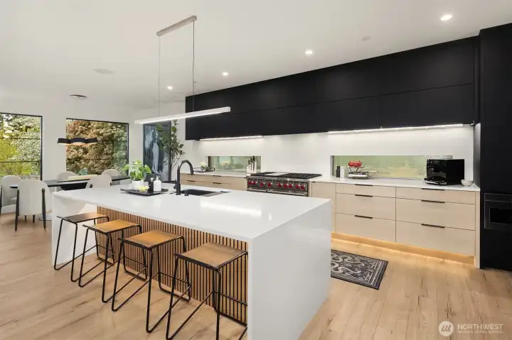 The 10' quartz waterfall island is the centerpiece of this gorgeous chef's kitchen.