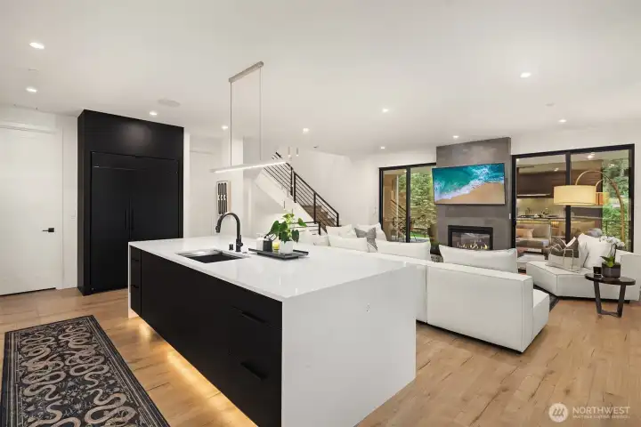 The Subzero refrigerator encased in the ebony cabinetry. Walk in pantry to the left.