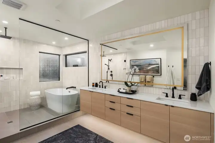 This serene, spa like bath has heated floors, wet room, dual vanities and full tile surround.