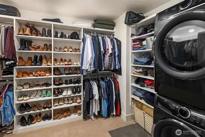 Huge walk-in closet has custom organizers and personal washer and dryer for your convenience.