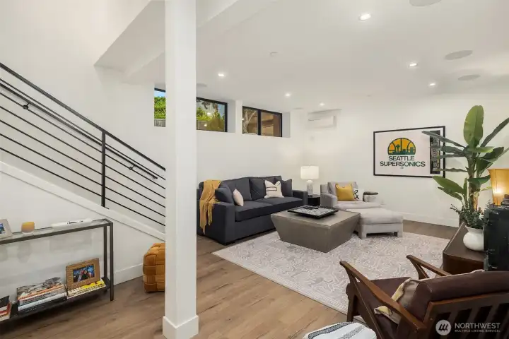 Lower level daylight bonus room features a 5.1 surround sound system.