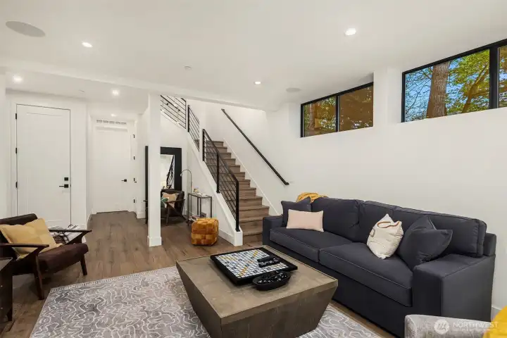 Lower level has 2 additional bedrooms, large utility room, and garage access.