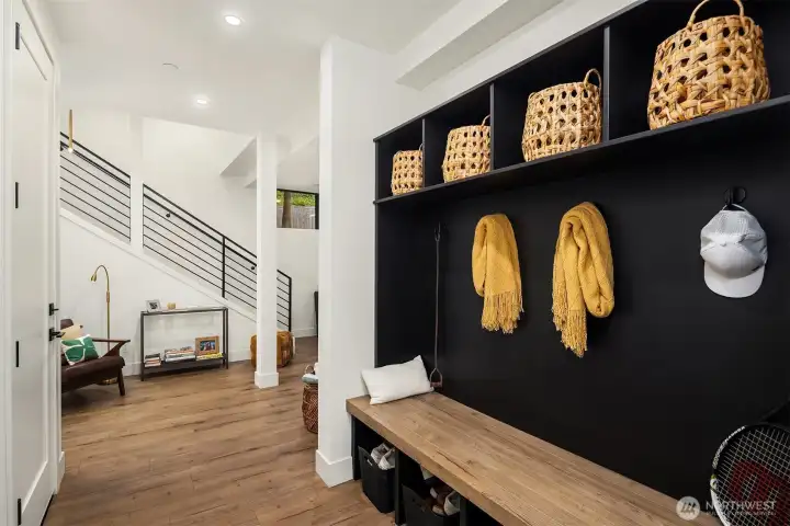 Mudroom just outside the fully finished 2-car garage with Tesla charger.