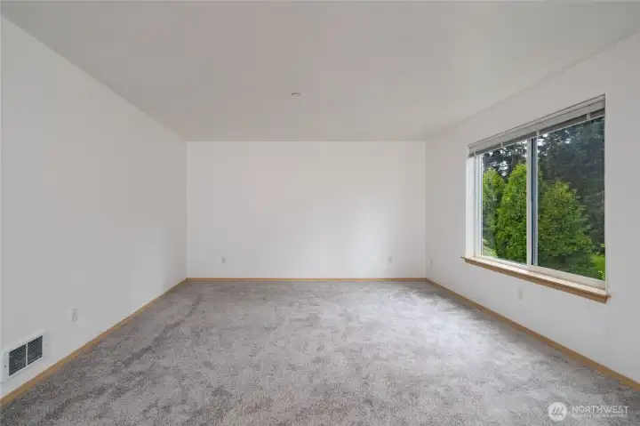 Living room, fresh paint and carpet. Lots of natural light.