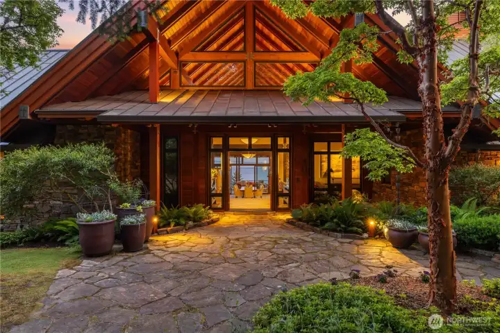 The resort-like entrance with magical pathways, lighting, and water features. The resort-like entrance with magical pathways, lighting, and water features.
