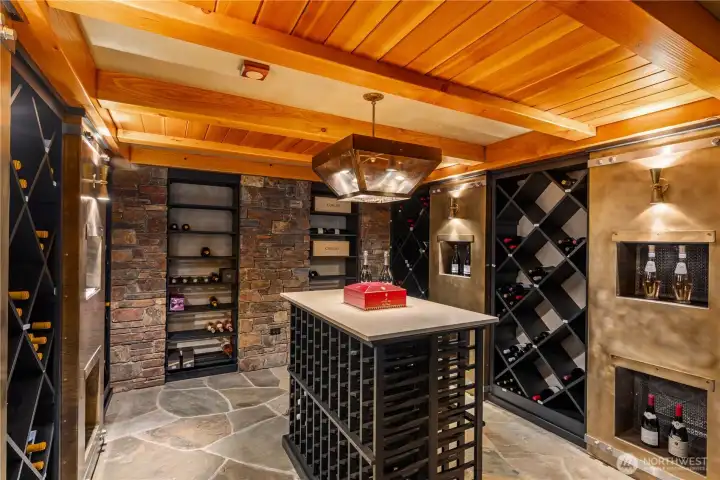 Conditioned wine room, with adjacent entry hall, craft room/storage, and concrete encased tunnels for commercial-level systems and construction. Conditioned wine room, with adjacent entry hall, craft room/storage, and concrete encased tunnels for commercial-level systems and construction.