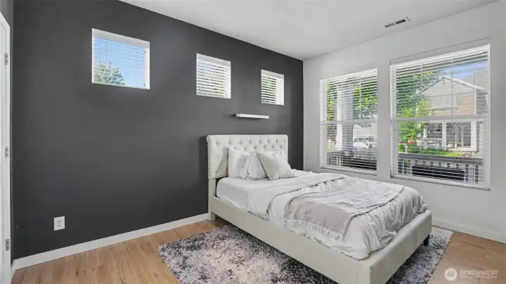 Downstairs bedroom with access to bathroom.