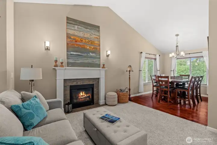 Enter into welcoming front room with vaulted ceilings.