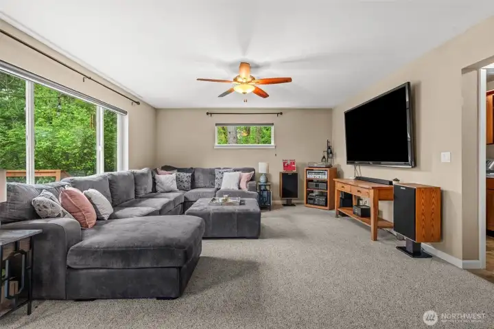Let's chill watch a movie or kick back listen to some tunes. Notice how windows perfectly frame the greenery.