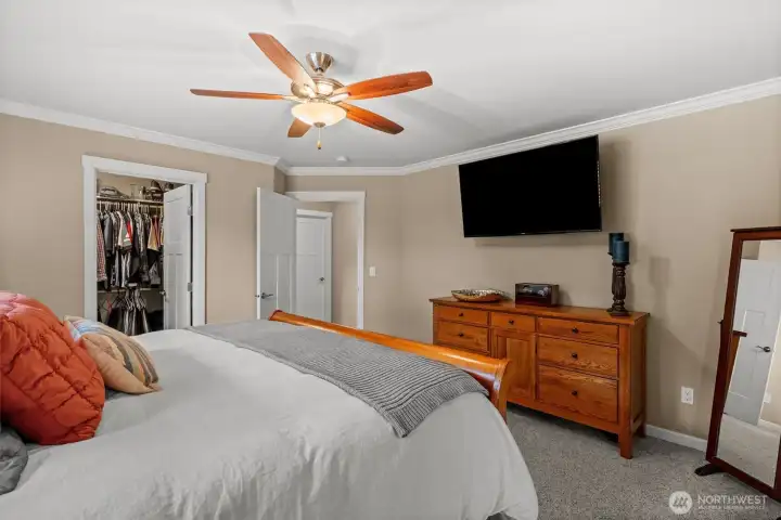 King Size Bed with view of walk-in closet.