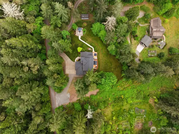 The acreage goes beyond what's pictures here. Seller paid for portion of trees to be cleared for future shop.