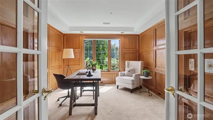 Private office/library with rich wood paneling. Private office/library with rich wood paneling.