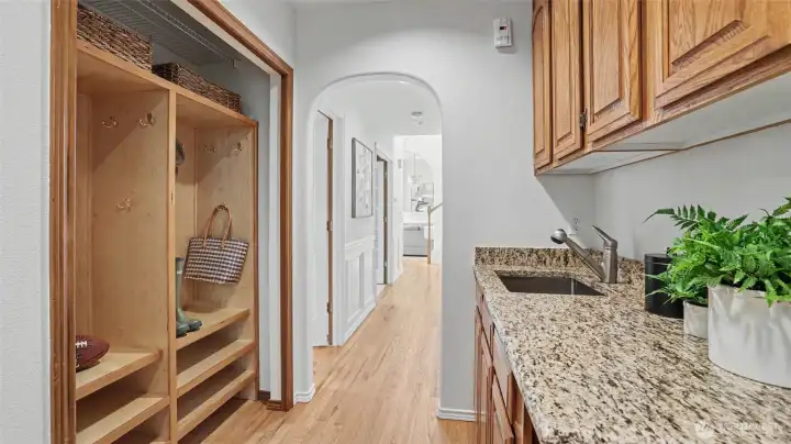 Mudroom with granite counters, sink, and cabinetry, just off the garage. Mudroom with granite counters, sink, and cabinetry, just off the garage.
