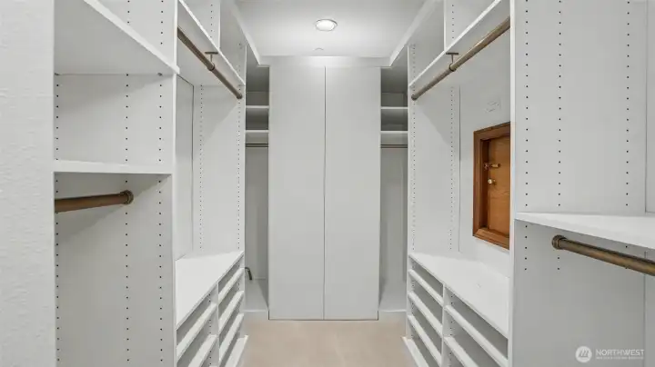 Primary closet, with an entrance to a 113 +/- sq ft additional attic storage for extra storage. Primary closet, with an entrance to a 113 +/- sq ft additional attic storage for extra storage.