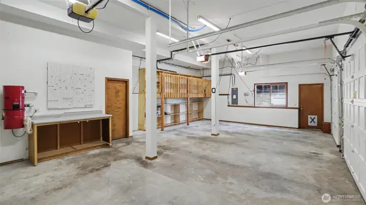 3-car garage with storage loft, bike hoists, and workbench. 3-car garage with storage loft, bike hoists, and workbench.