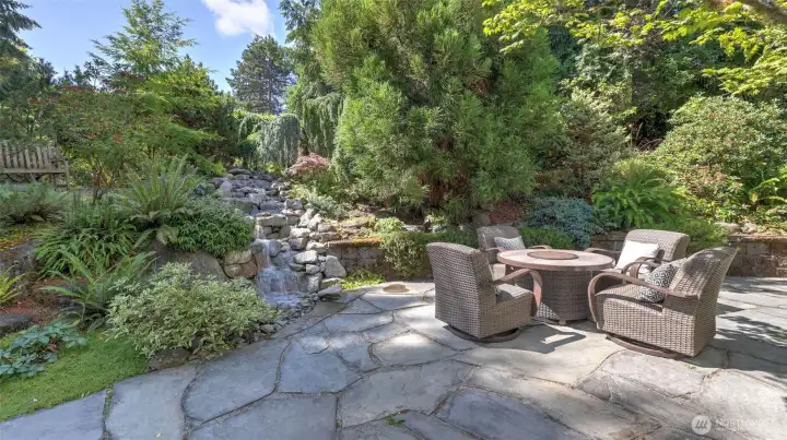 Pondless waterfall with automatic lighting and bluestone patio. Pondless waterfall with automatic lighting and bluestone patio.