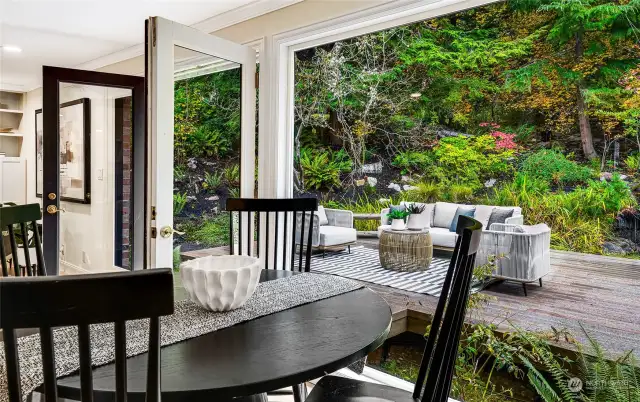 The everyday dining with views of the expansive patio and backyard oasis.