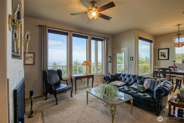 The family room features a propane fireplace, kitchen dining area, computer work station and the door out to the sundeck.
