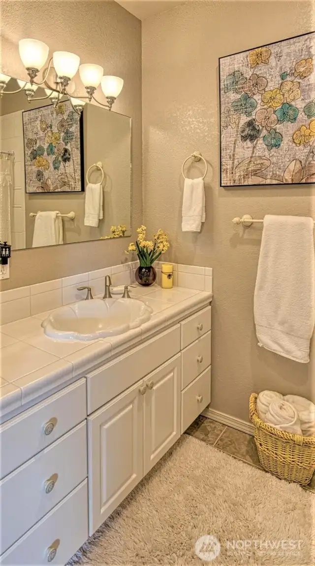 Upper level bedroom has a full bathroom.