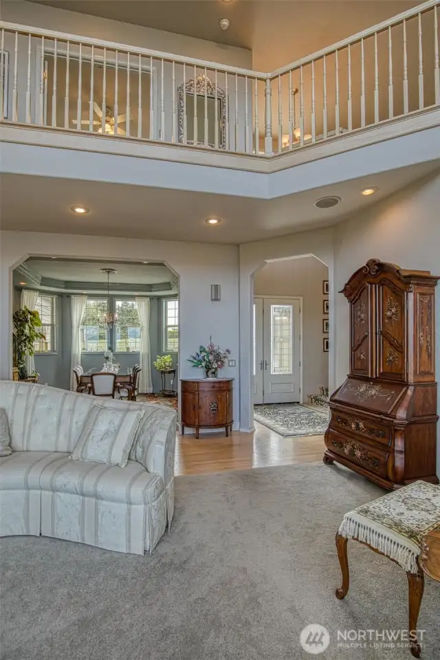 Entrance and upper level balcony. View from living room.